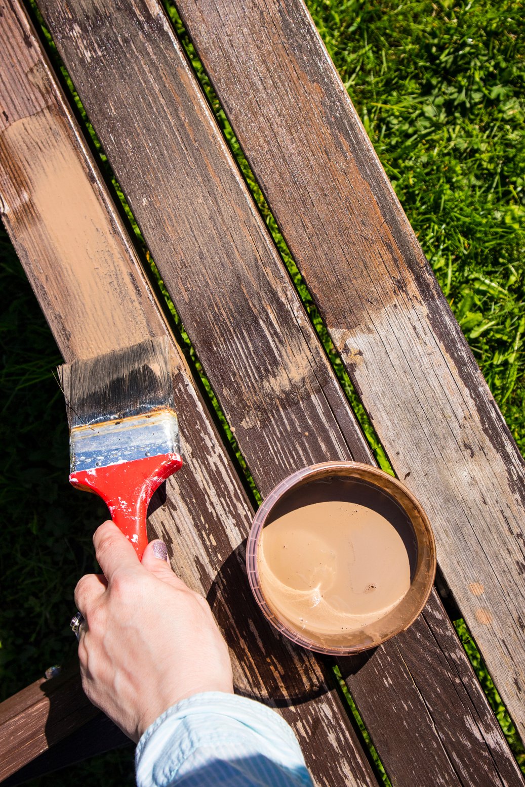 Hand staining wood furniture with brush and brown wood stain